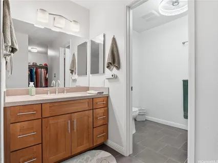 a bathroom with a double vanity sink and a mirror