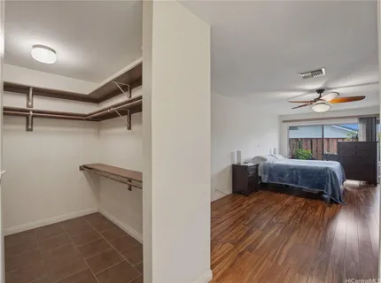 a bedroom with furniture and a window