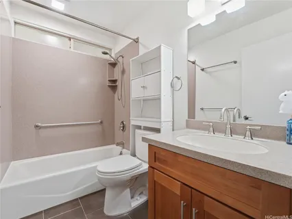 a bathroom with a sink a toilet and a bathtub