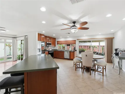 a living room with furniture and kitchen view