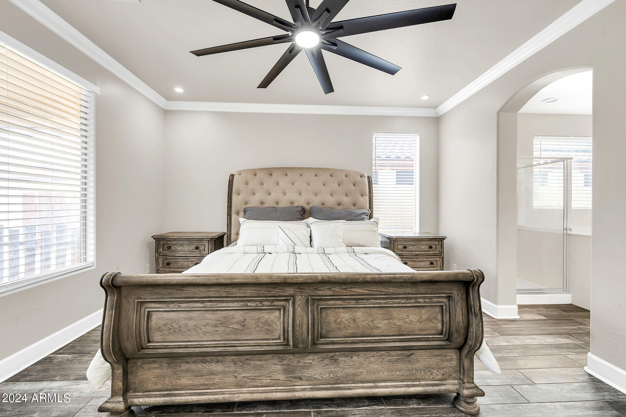 10125 West Payson Road Tolleson, AZ 85353 - Photo 12 of 35 a bedroom with a bed and window
