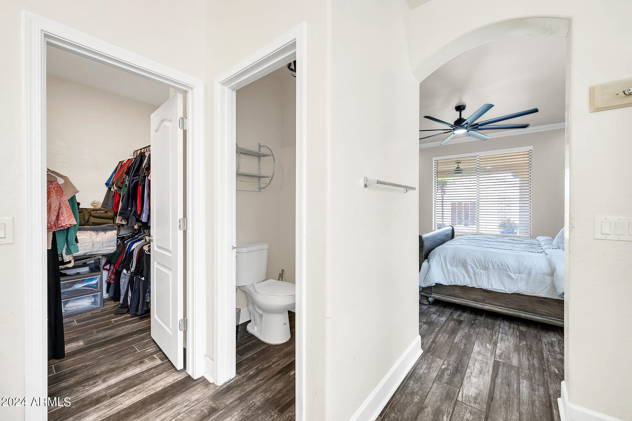 10125 West Payson Road Tolleson, AZ 85353 - Photo 15 of 35 a bedroom with a bed and a view of bathroom