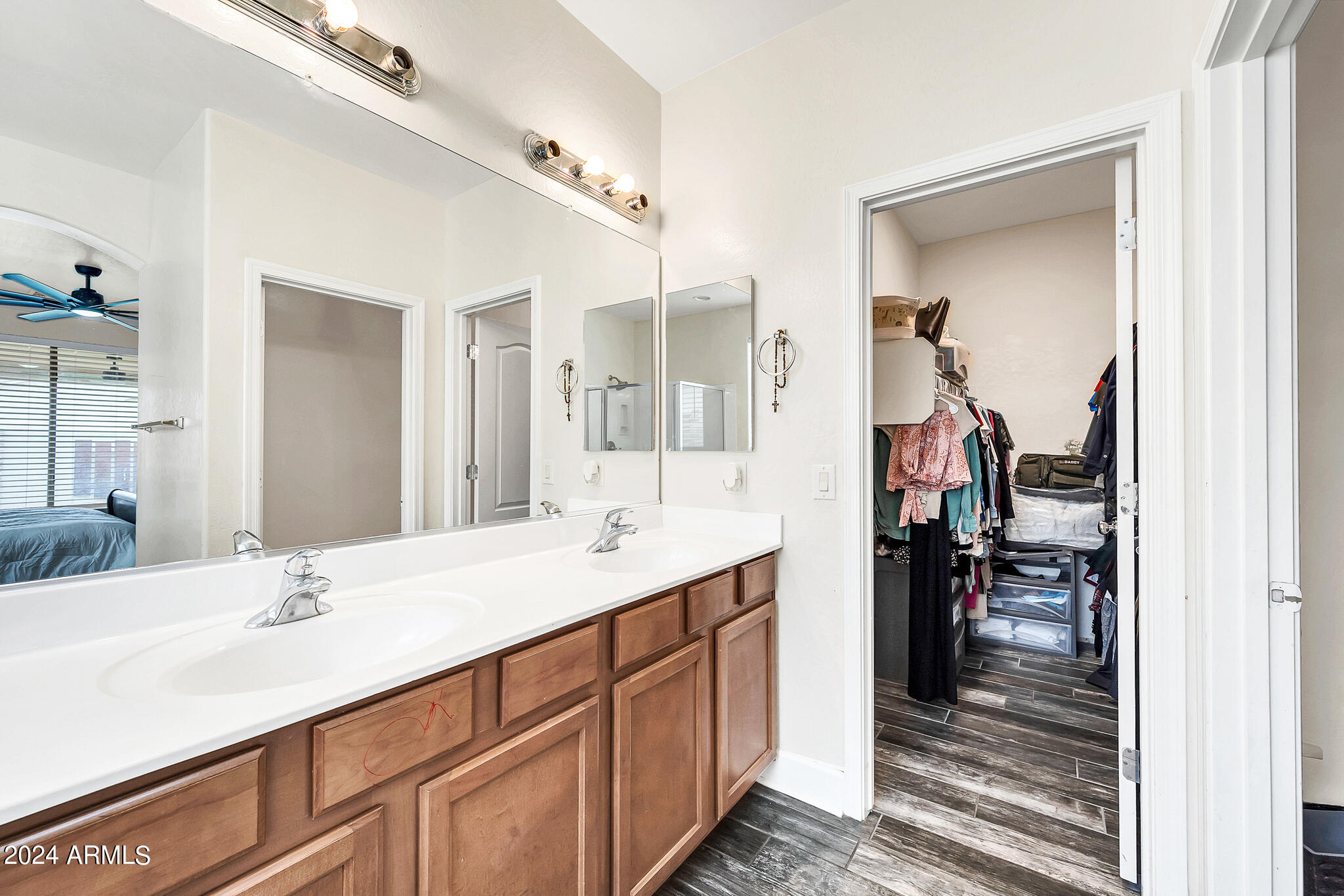 10125 West Payson Road Tolleson, AZ 85353 - Photo 16 of 35 a en suite bathroom with a sink double vanity and a mirror