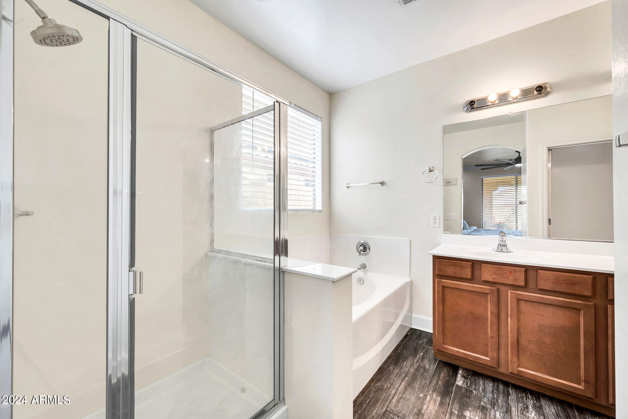10125 West Payson Road Tolleson, AZ 85353 - Photo 17 of 35 a spacious bathroom with a double vanity sink a mirror and a bathtub