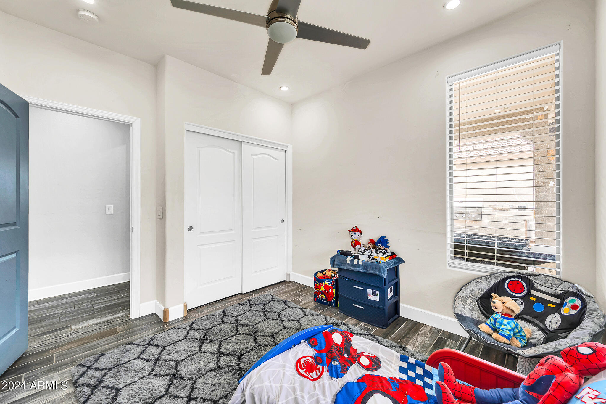 10125 West Payson Road Tolleson, AZ 85353 - Photo 23 of 35 a bedroom with furniture and a window