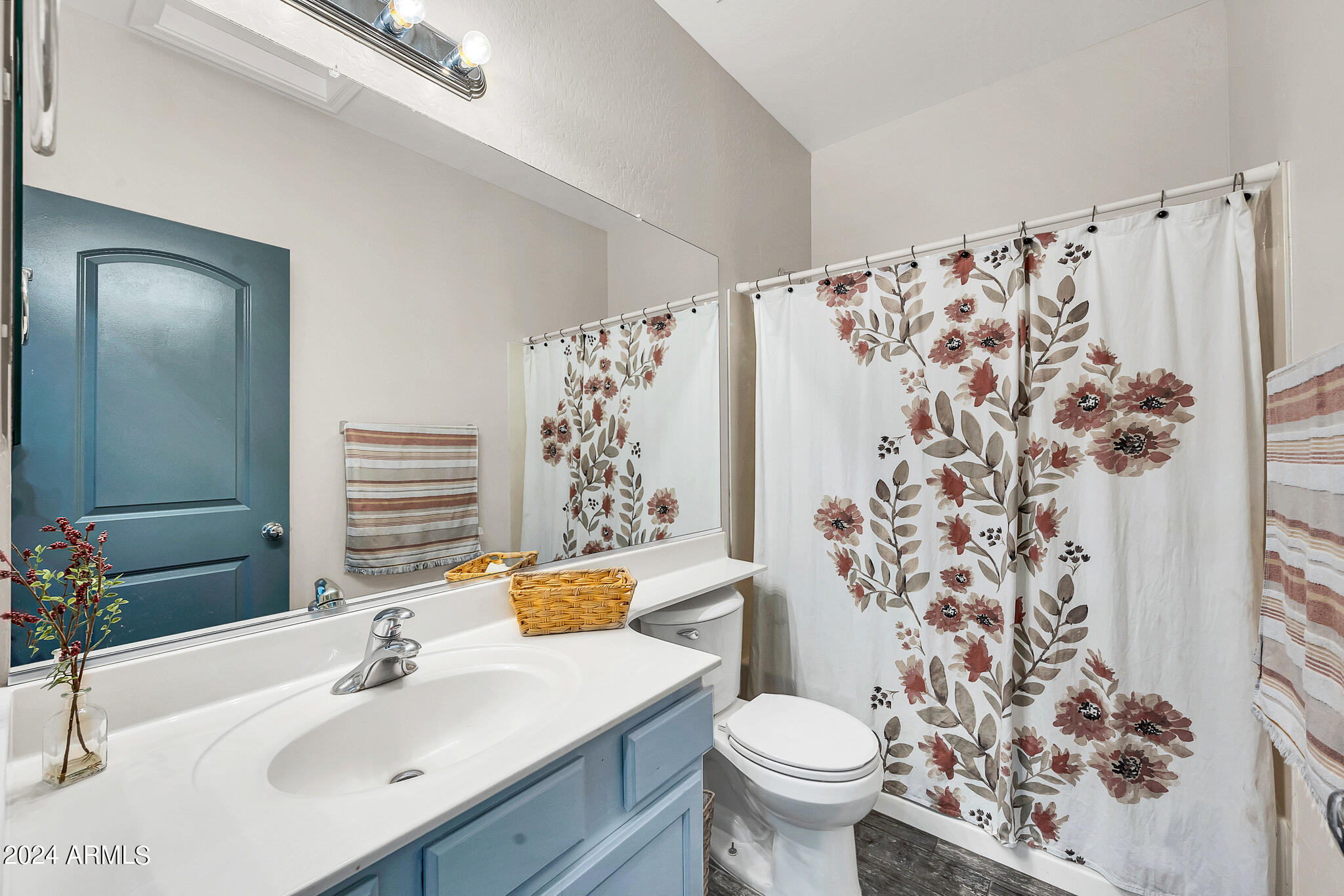 10125 West Payson Road Tolleson, AZ 85353 - Photo 25 of 35 a bathroom with a sink toilet and shower