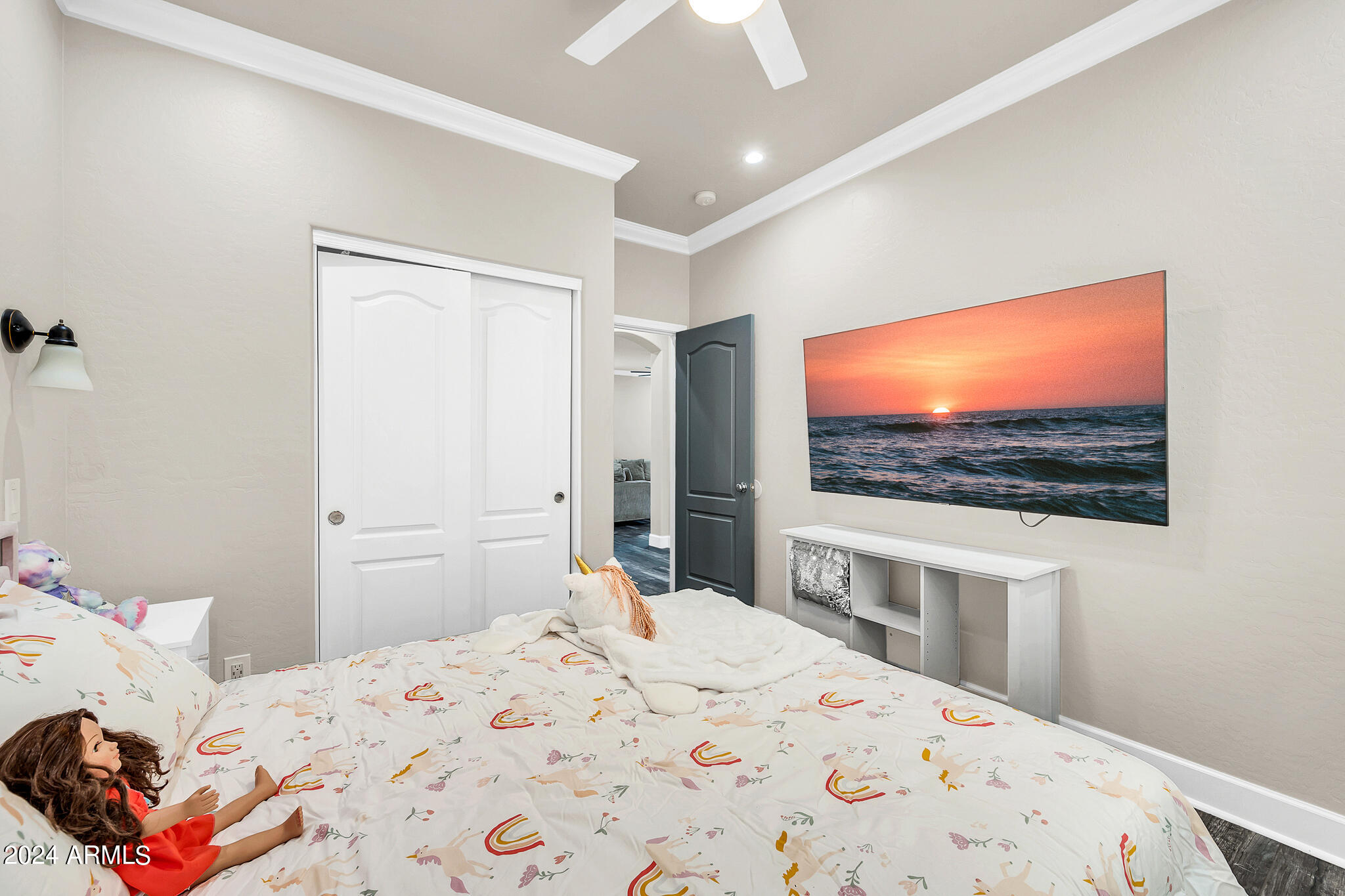 10125 West Payson Road Tolleson, AZ 85353 - Photo 28 of 35 a bedroom with a bed and a flat screen tv