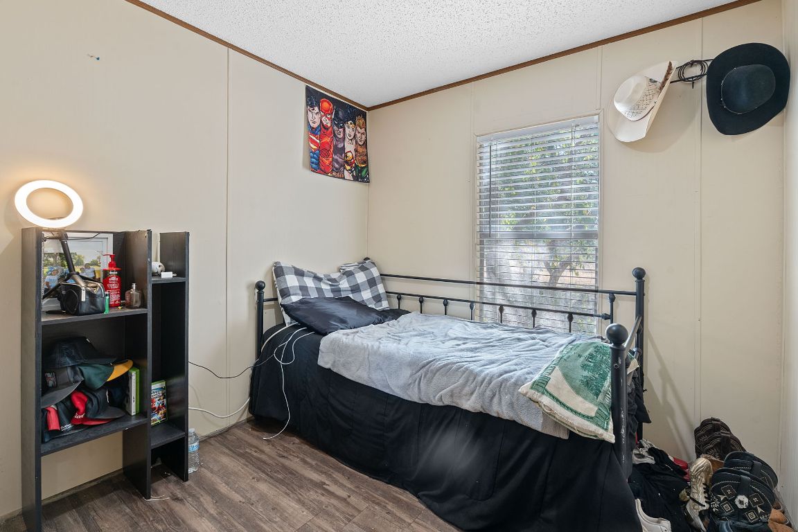 155 Forister Ranch Drive Dale, TX 78616 - Photo 19 of 30 a bedroom with a bed and a window