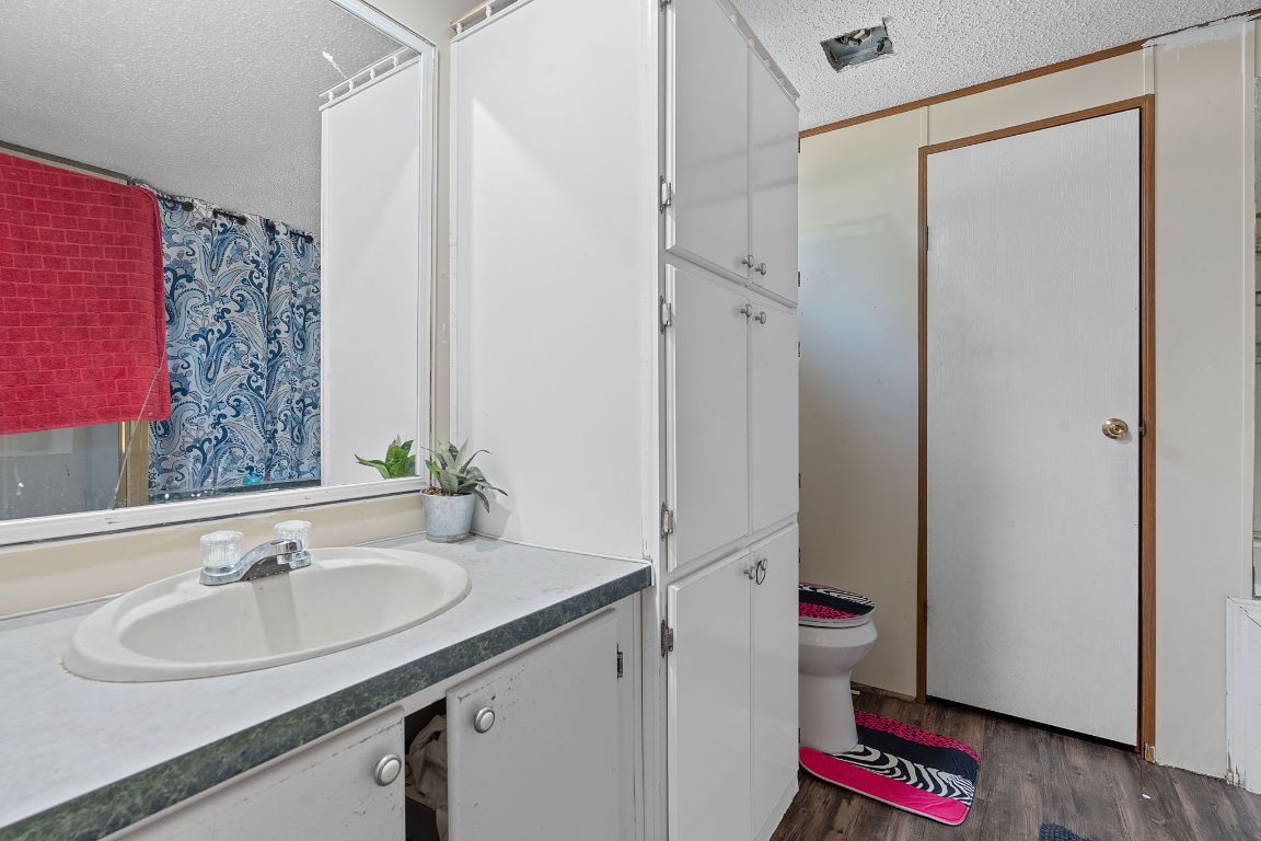 155 Forister Ranch Drive Dale, TX 78616 - Photo 20 of 30 a bathroom with a sink and a mirror