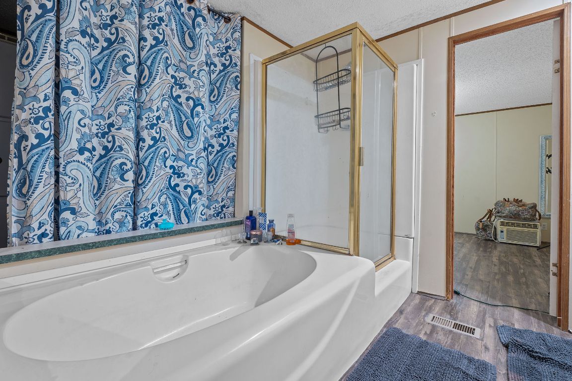 155 Forister Ranch Drive Dale, TX 78616 - Photo 21 of 30 a bathroom with a bathtub and shower