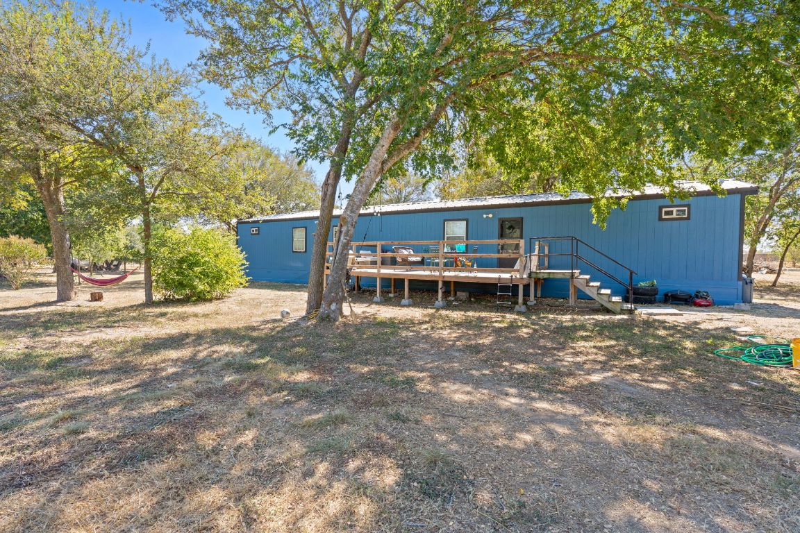 155 Forister Ranch Drive Dale, TX 78616 - Photo 3 of 30 a view of a house with a yard and large trees
