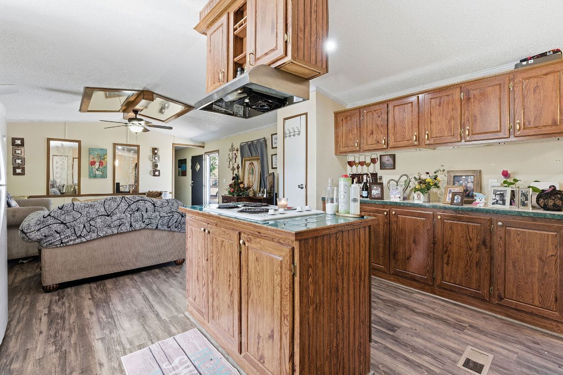 155 Forister Ranch Drive Dale, TX 78616 - Photo 9 of 30 a kitchen with cabinets and wooden floor