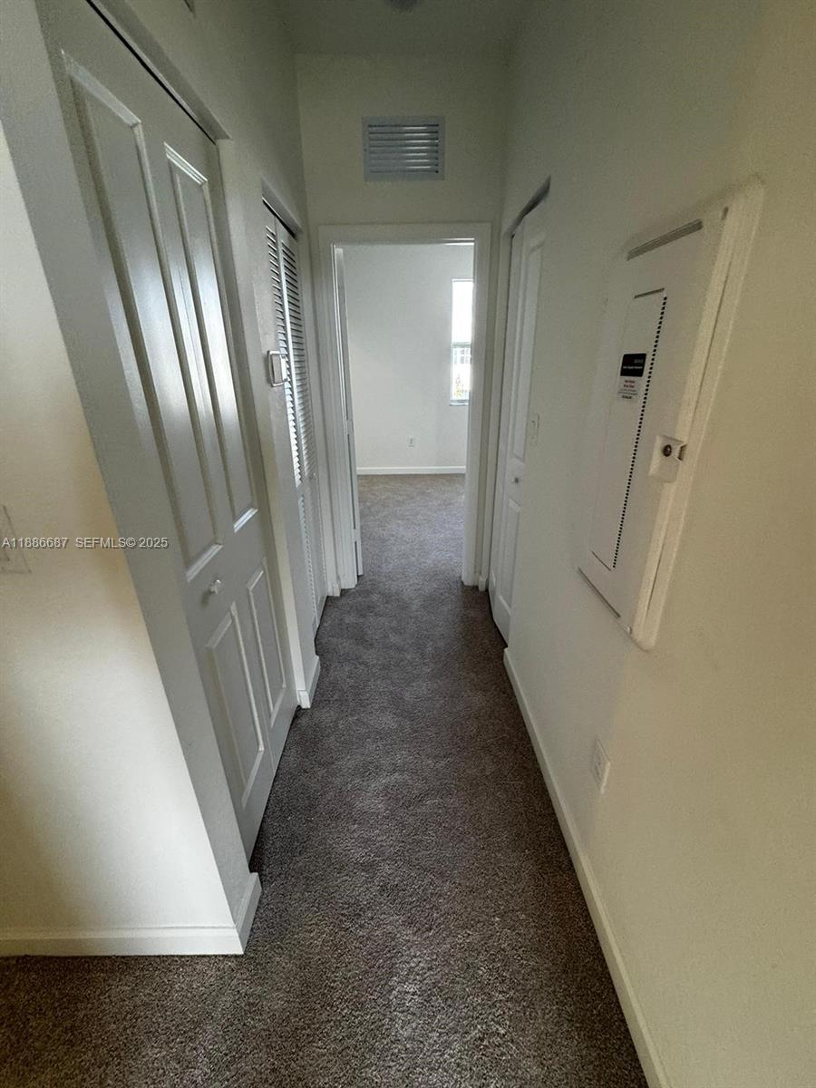 16270 Southwest 292nd Street Homestead, FL 33033 - Photo 12 of 29 a view of a hallway with staircase