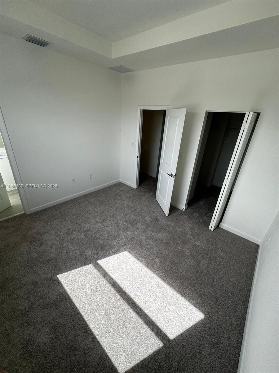16270 Southwest 292nd Street Homestead, FL 33033 - Photo 13 of 29 a view of an empty room and windows