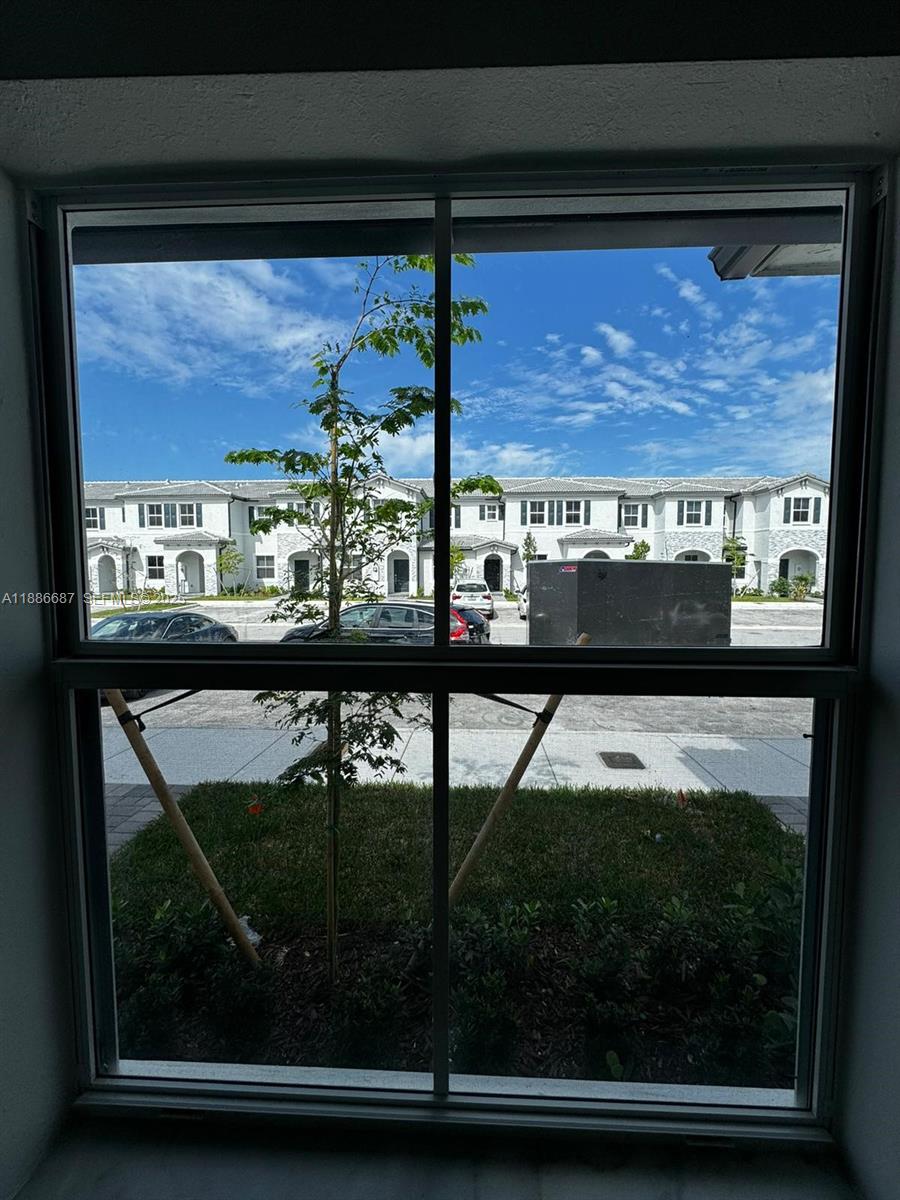 16270 Southwest 292nd Street Homestead, FL 33033 - Photo 17 of 29 a view of a porch with a bench