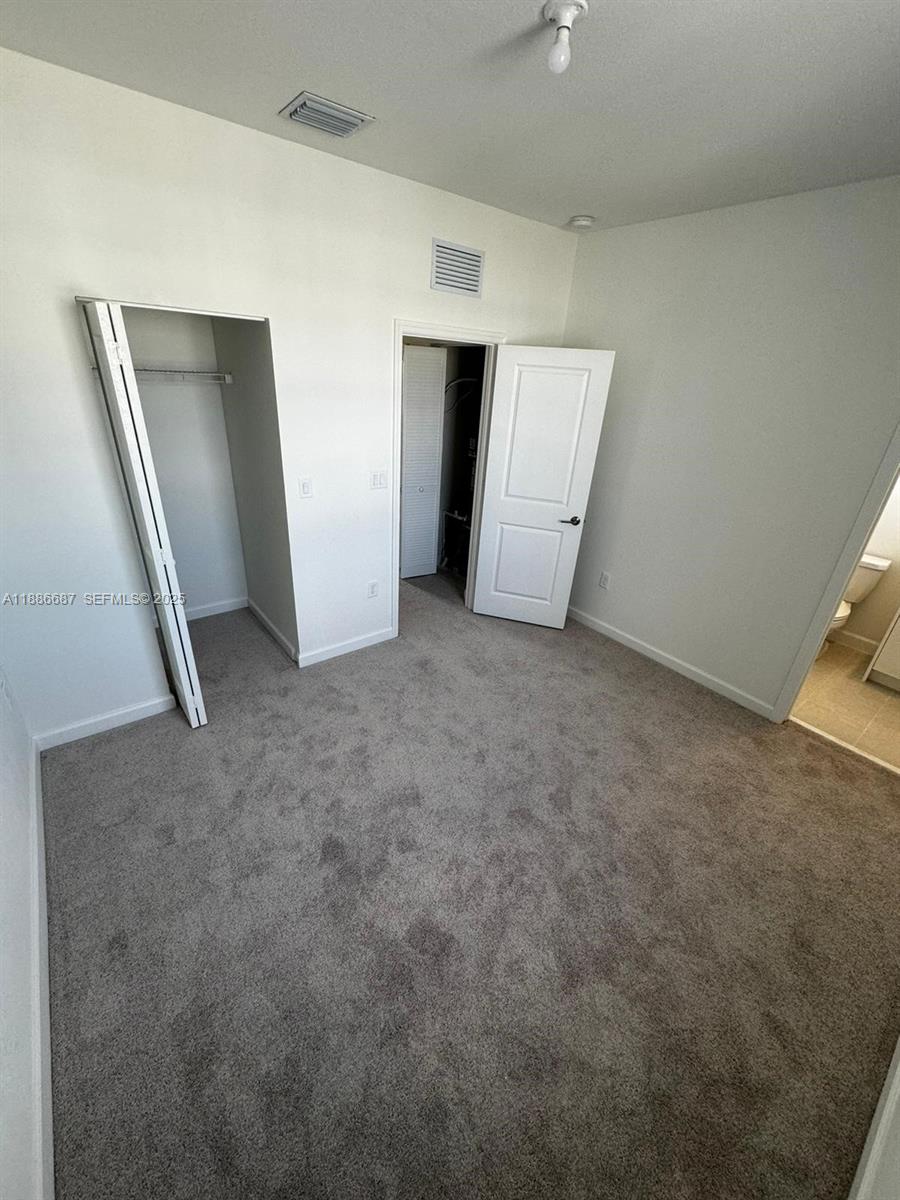 16270 Southwest 292nd Street Homestead, FL 33033 - Photo 19 of 29 a view of an empty room with closet