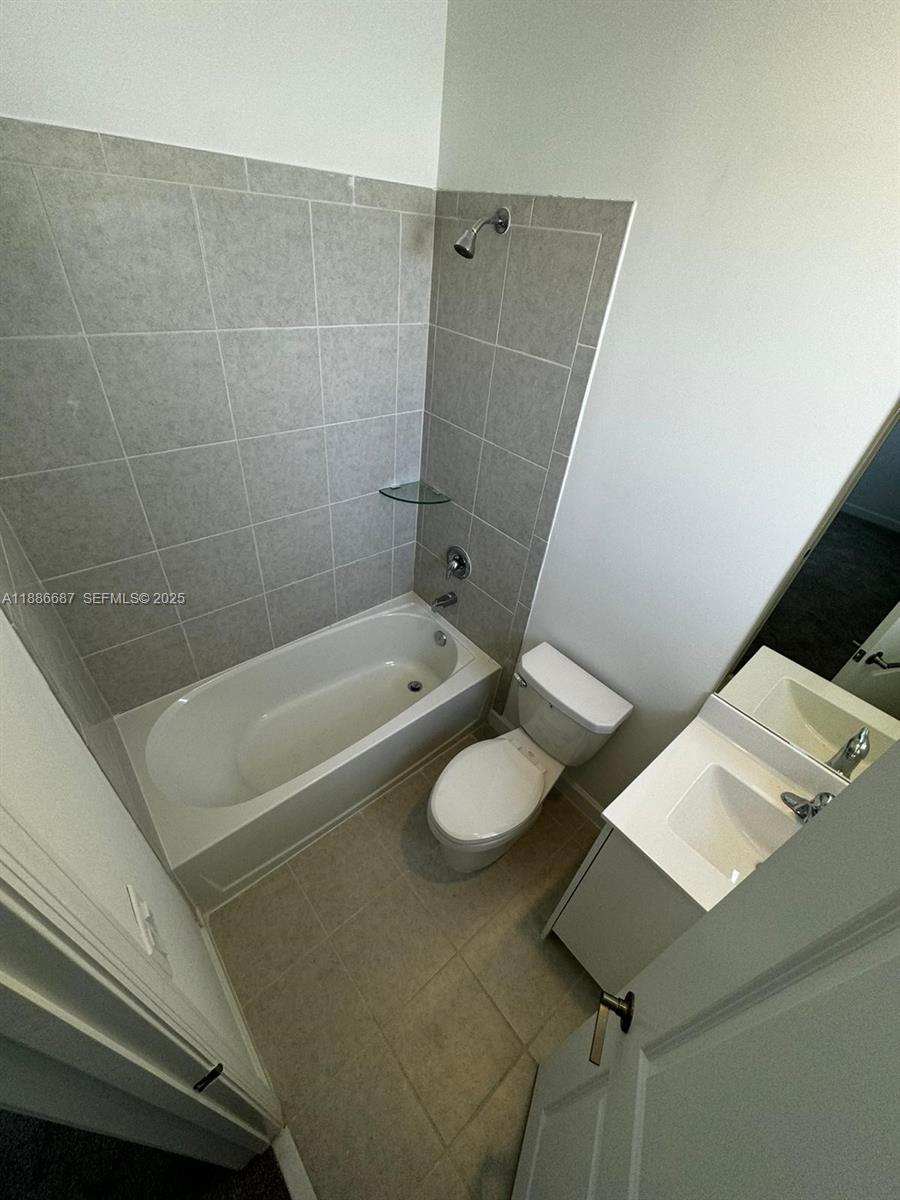 16270 Southwest 292nd Street Homestead, FL 33033 - Photo 20 of 29 a bathroom with a bathtub and sink