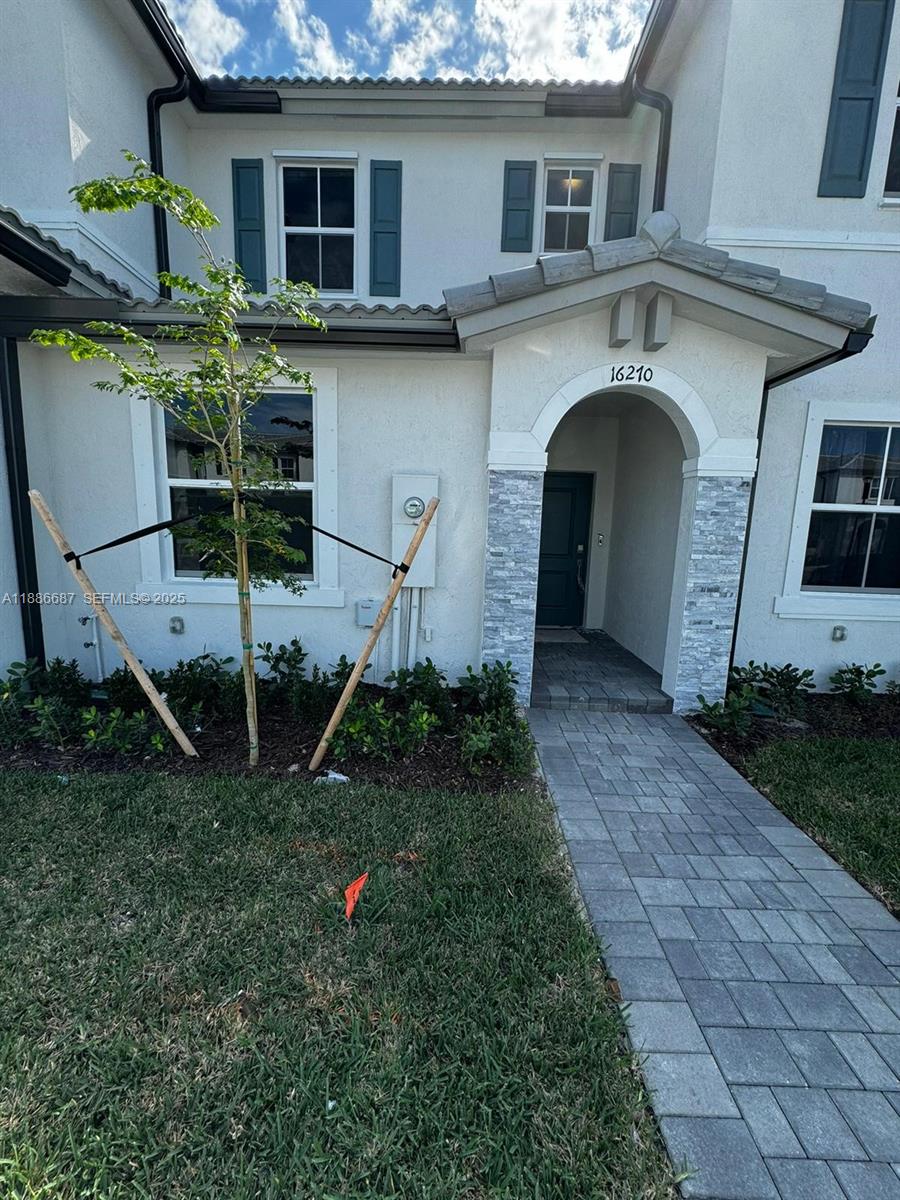 16270 Southwest 292nd Street Homestead, FL 33033 - Photo 2 of 29 a front view of a house with plants