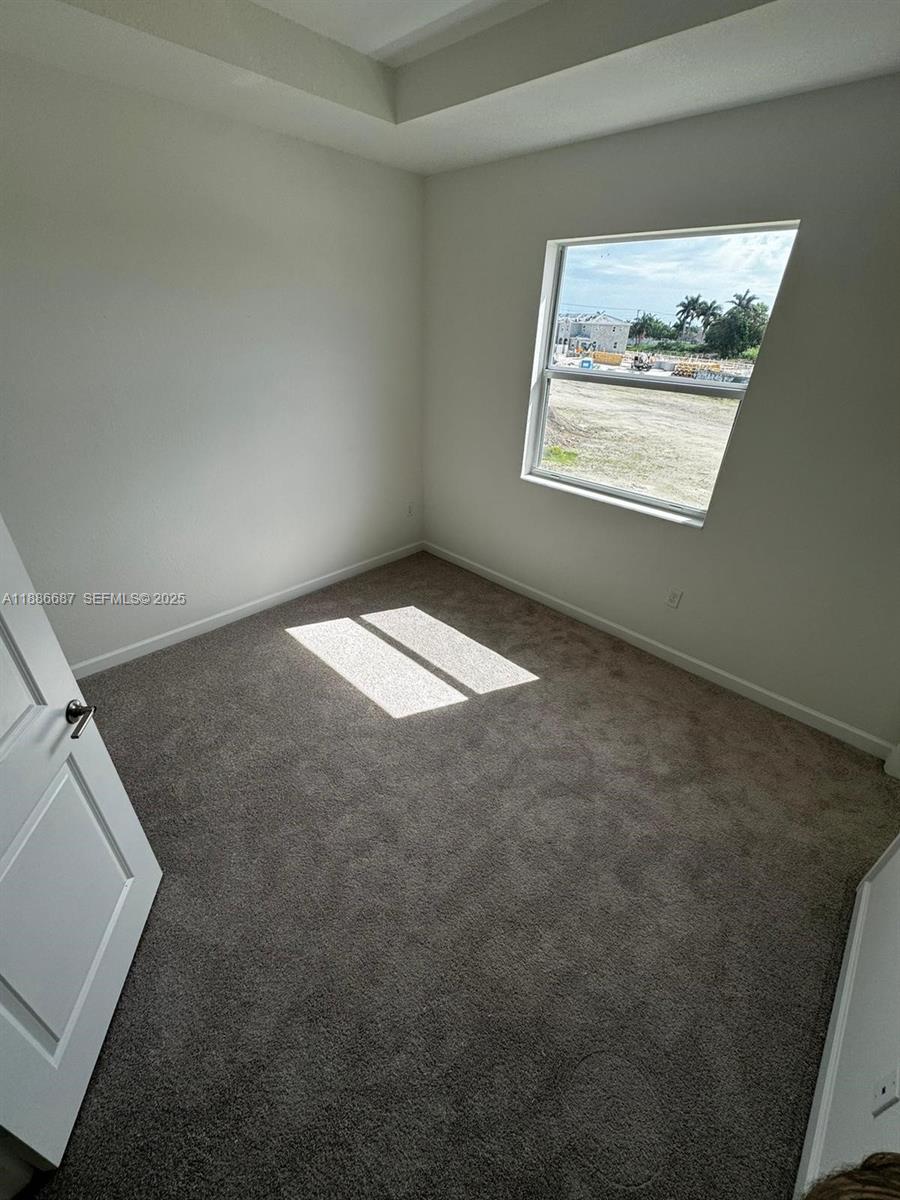 16270 Southwest 292nd Street Homestead, FL 33033 - Photo 21 of 29 an empty room with windows