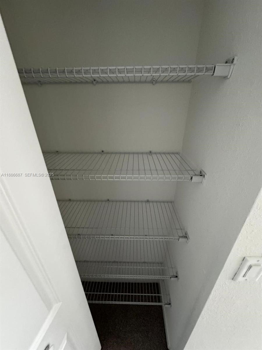 16270 Southwest 292nd Street Homestead, FL 33033 - Photo 22 of 29 a view of small space with racks on the wall