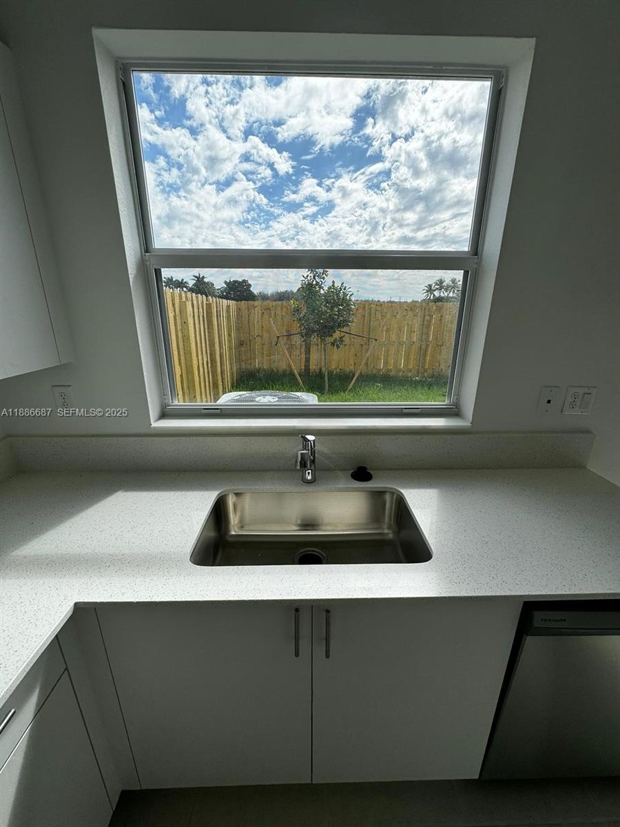 16270 Southwest 292nd Street Homestead, FL 33033 - Photo 7 of 29 a sink with a cabinet and window