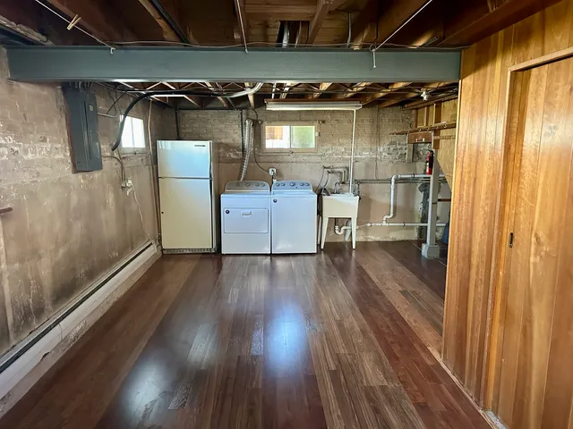 a view of walk in closet with wooden floor