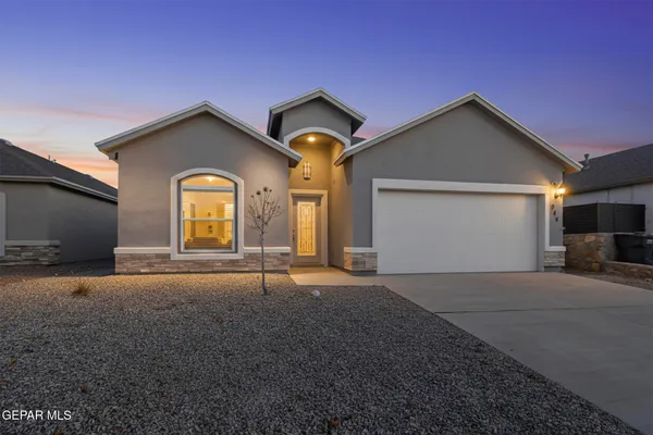 a view of backyard and garage