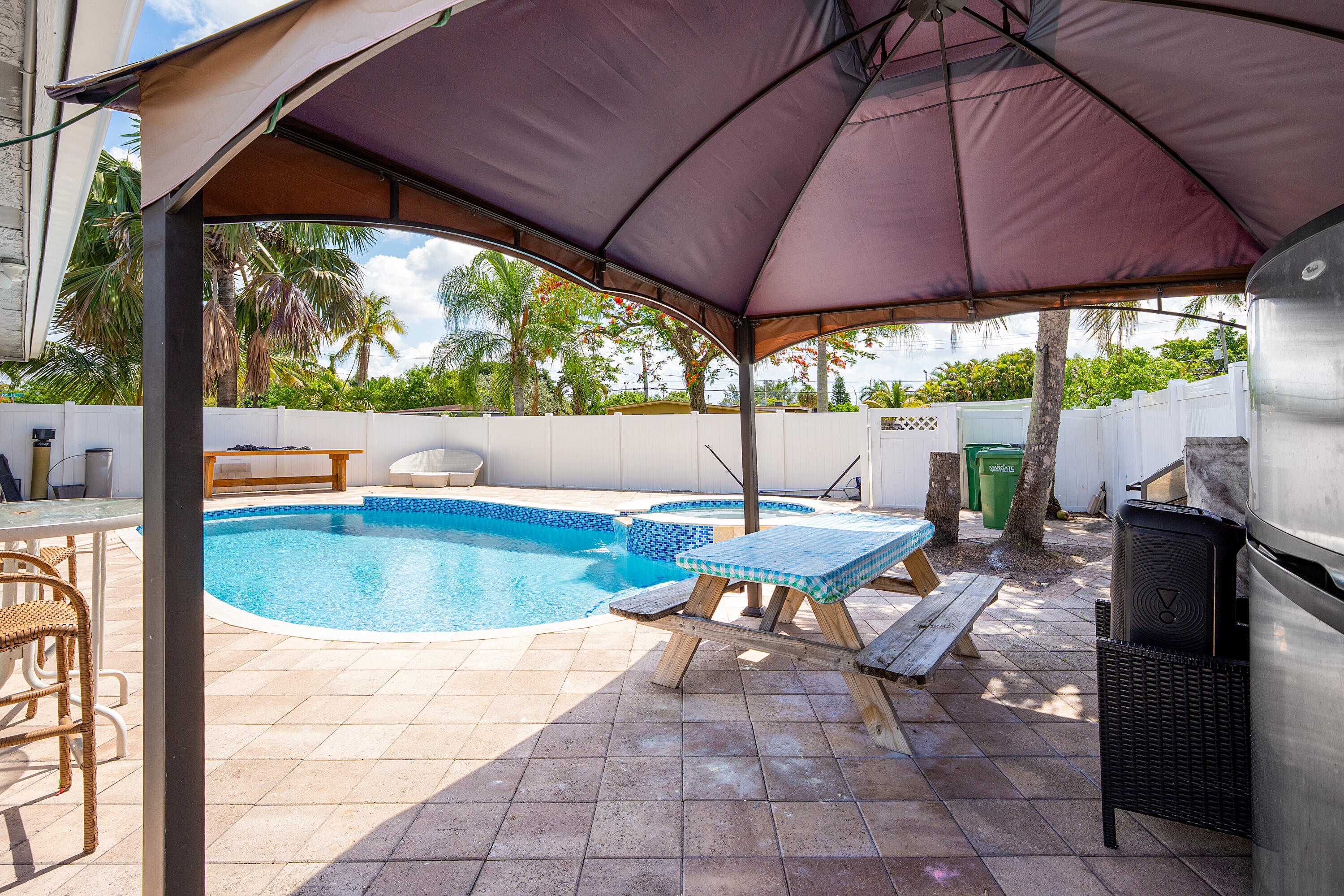 a view of swimming pool with outdoor seating