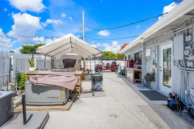a swimming pool with table and chairs