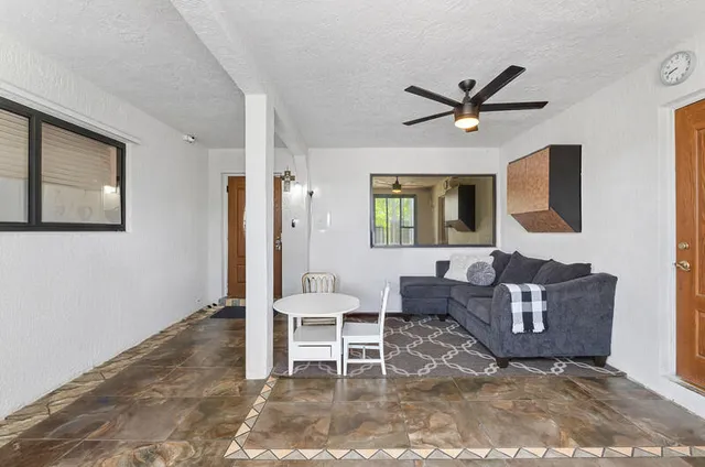 a living room with furniture and a window