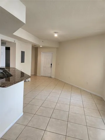 a view of a livingroom with wooden furniture