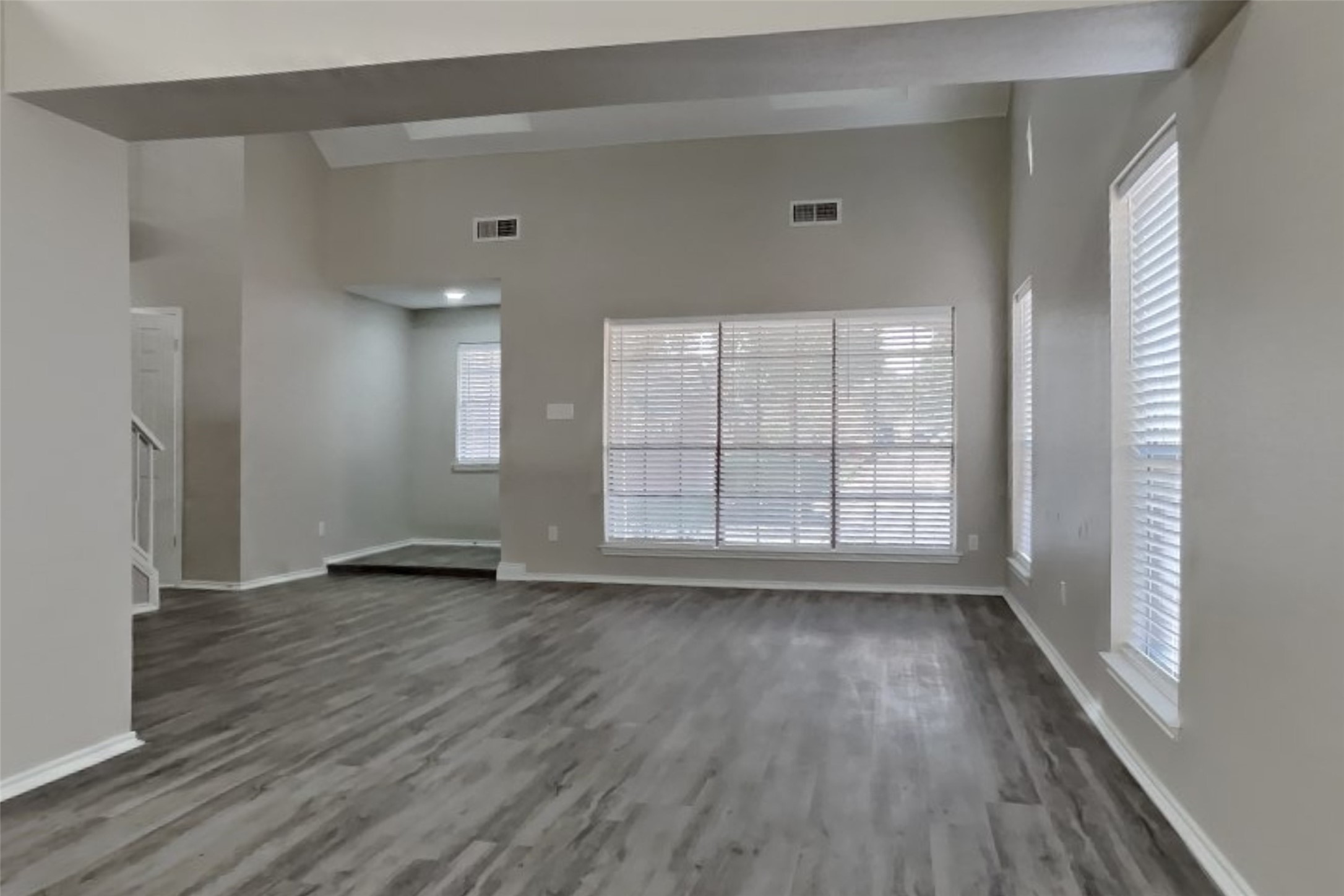 17030 Highworth Drive Spring, TX 77379 - Photo 4 of 24 a view of an empty room with wooden floor and a window