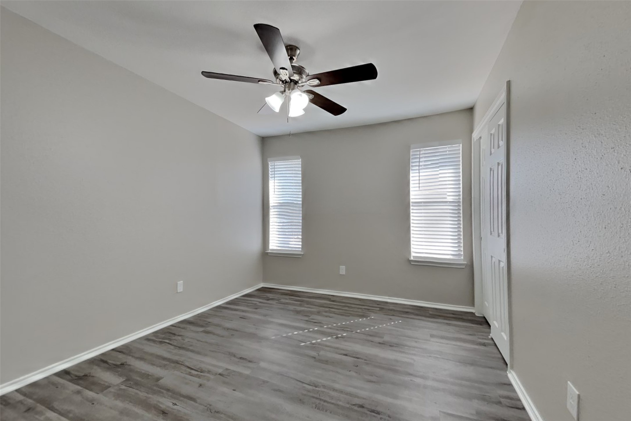 17030 Highworth Drive Spring, TX 77379 - Photo 8 of 24 a view of an empty room with wooden floor and a window