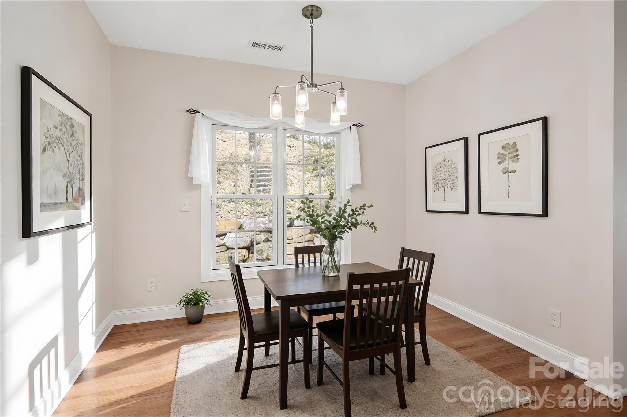 455 Blue Mist Way Arden, NC 28704 - Photo 11 of 46 a view of a dining room with furniture window and wooden floor