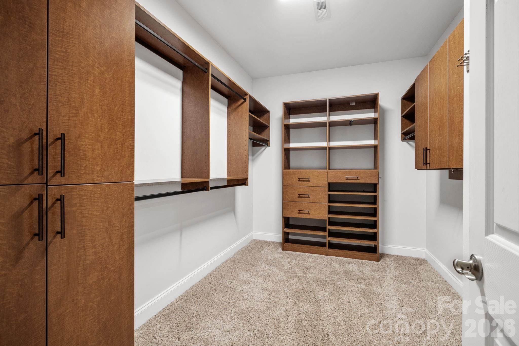 455 Blue Mist Way Arden, NC 28704 - Photo 25 of 46 a view of closet area with empty racks