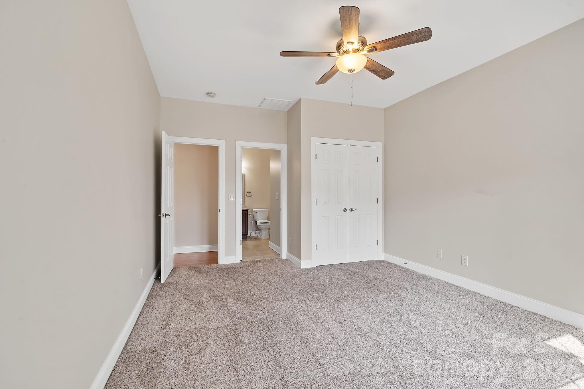 455 Blue Mist Way Arden, NC 28704 - Photo 27 of 46 wooden floor in an empty room with a chandelier fan