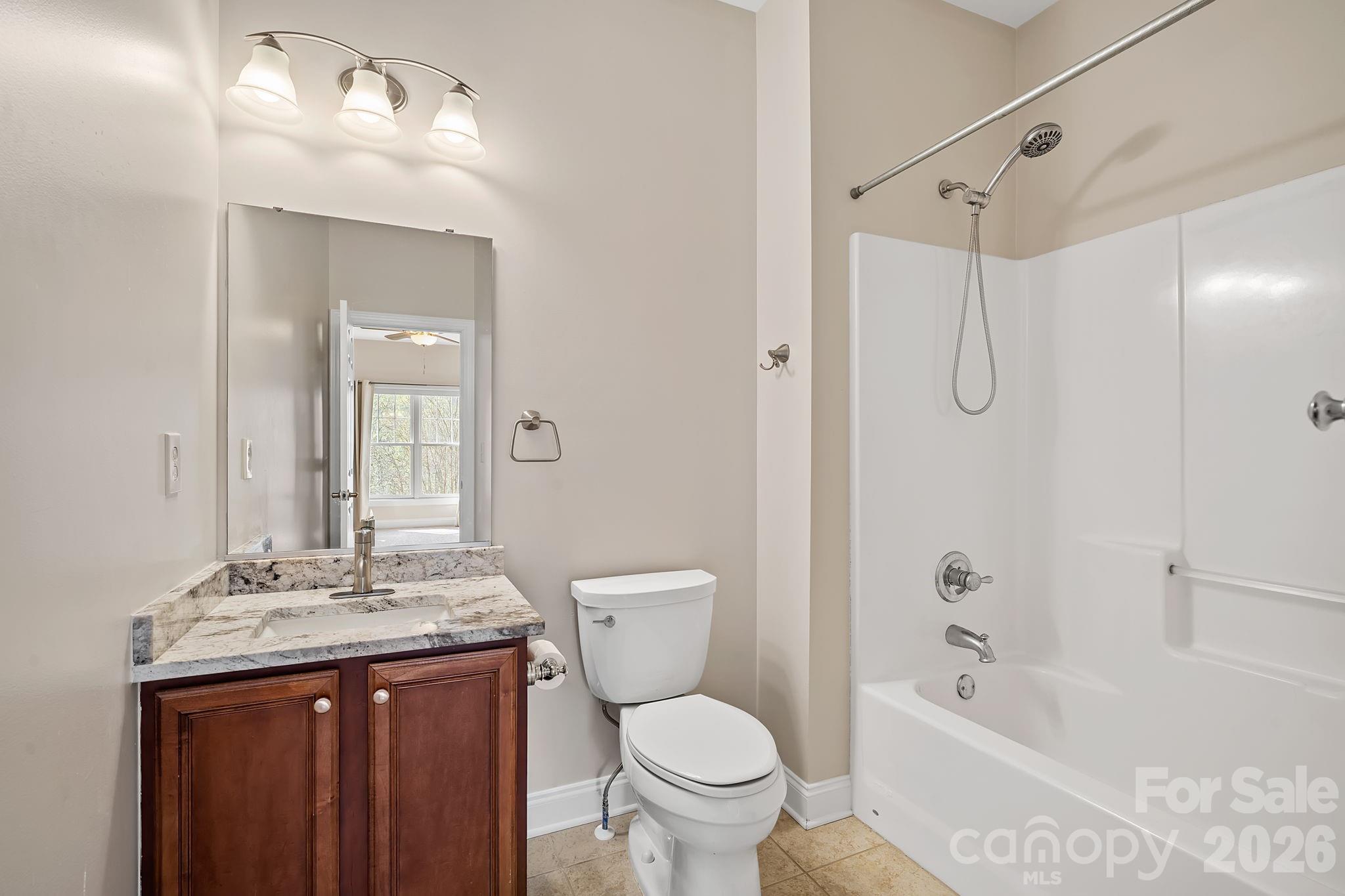 455 Blue Mist Way Arden, NC 28704 - Photo 28 of 46 a bathroom with a granite countertop sink toilet and shower