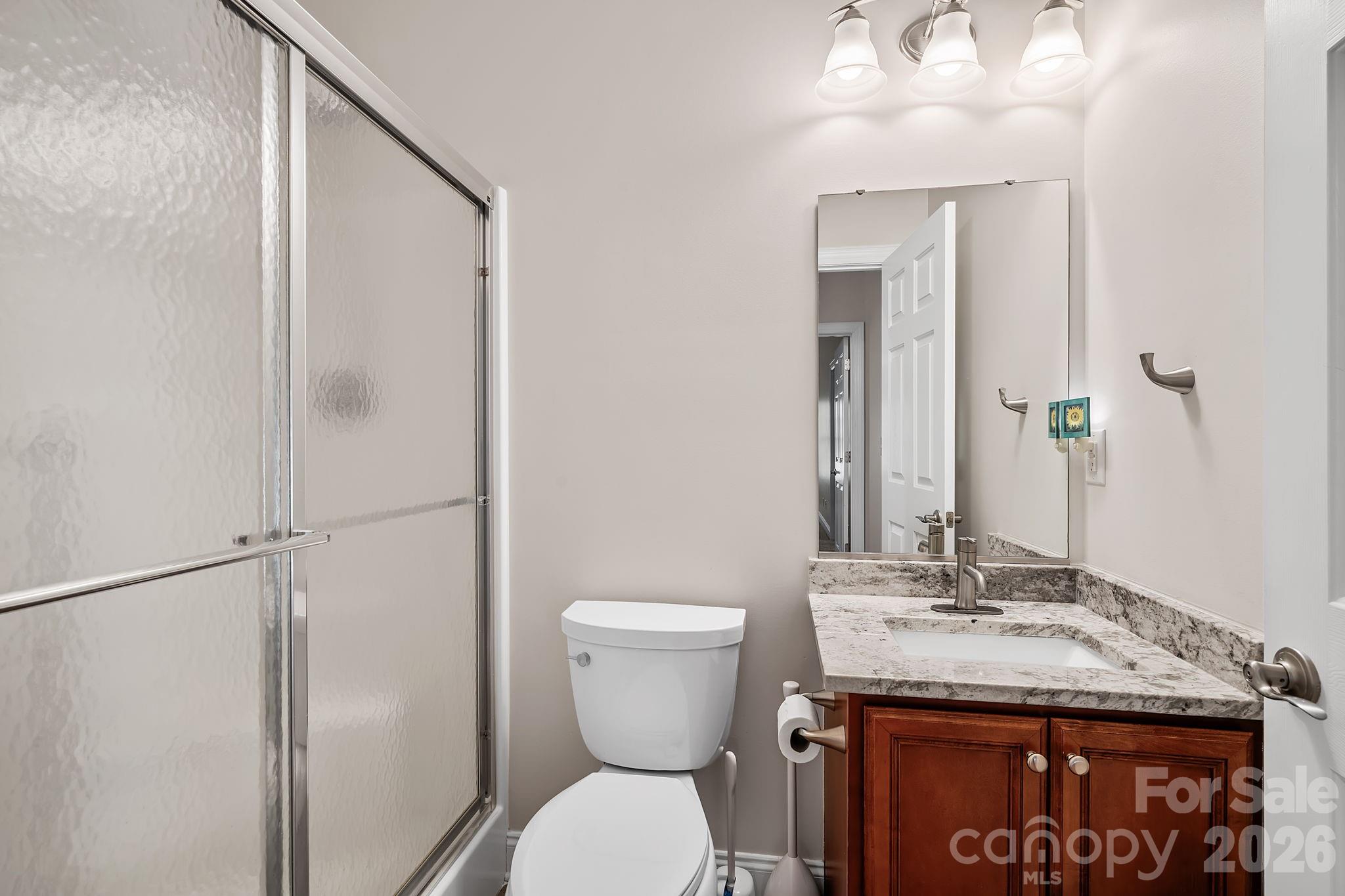 455 Blue Mist Way Arden, NC 28704 - Photo 30 of 46 a bathroom with a granite countertop sink toilet and shower