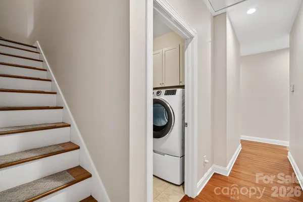 a view of a hallway with washer and dryer