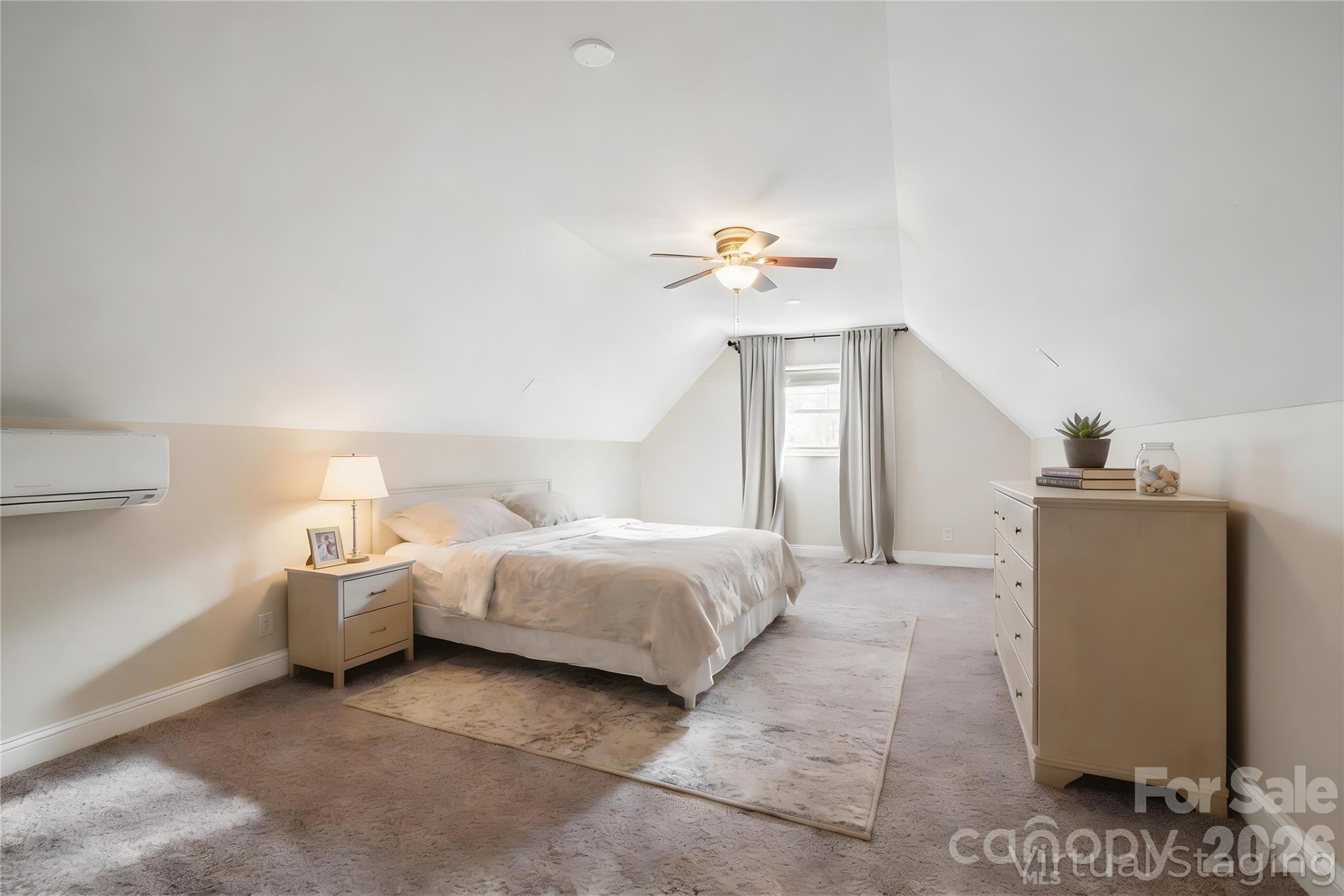 455 Blue Mist Way Arden, NC 28704 - Photo 33 of 46 a bedroom with a bed and a chandelier