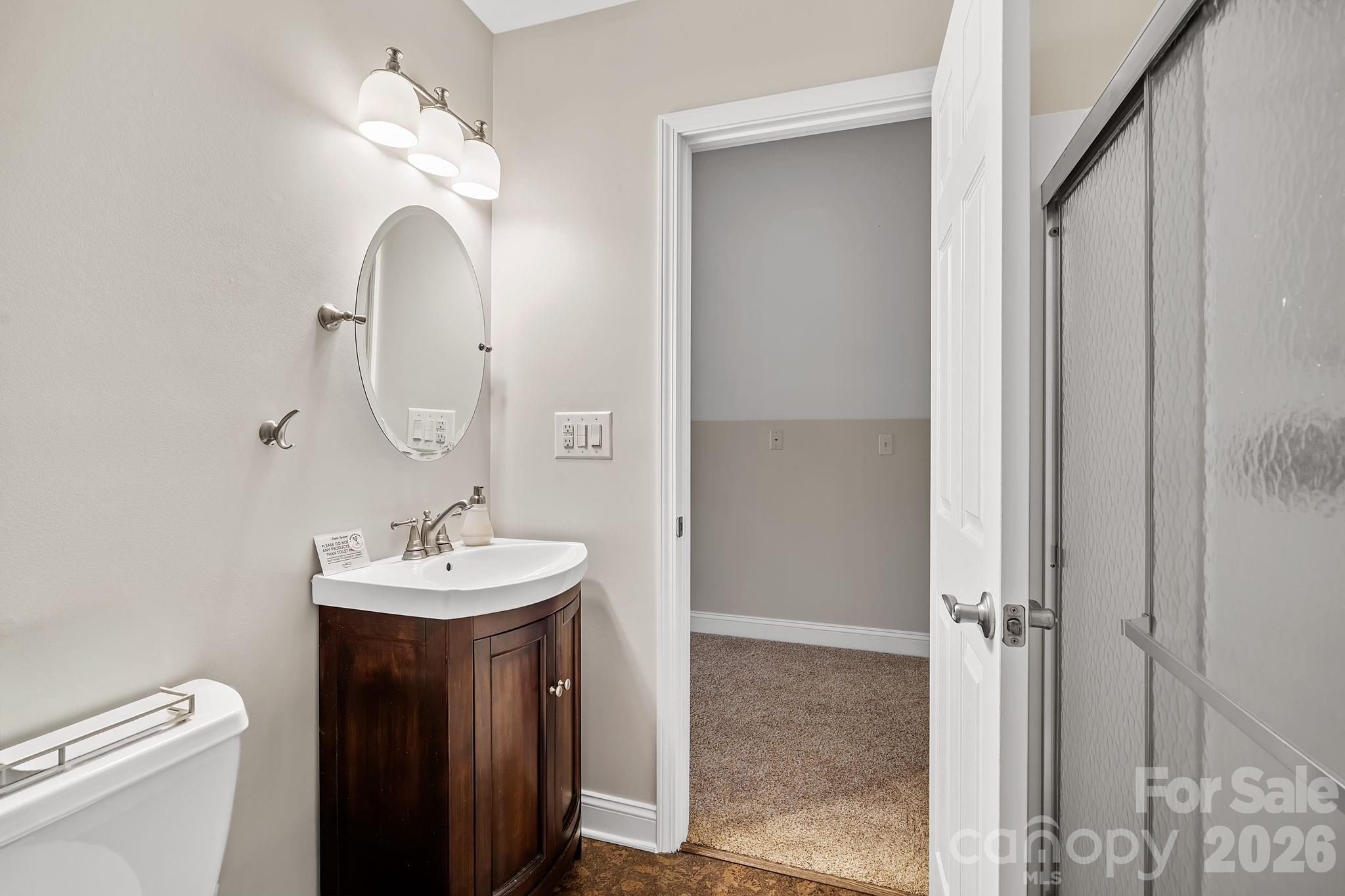 455 Blue Mist Way Arden, NC 28704 - Photo 34 of 46 a bathroom with a sink a toilet and a mirror