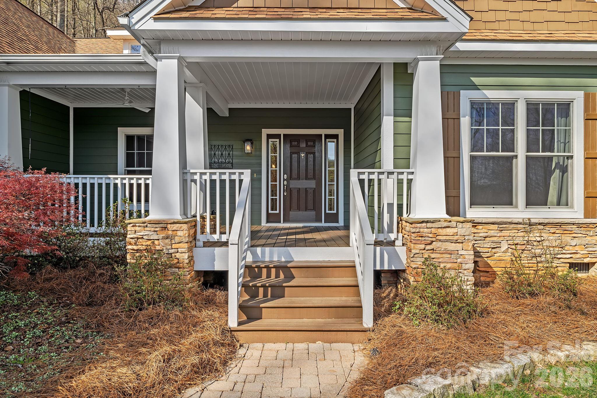 455 Blue Mist Way Arden, NC 28704 - Photo 4 of 46 a front view of a house with a porch