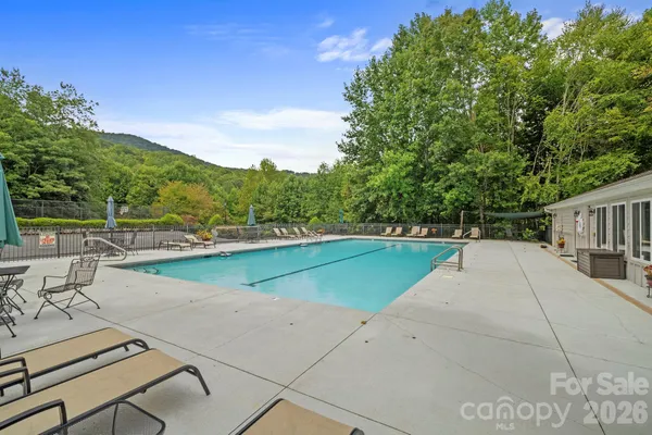 a view of a swimming pool with a lounge chair