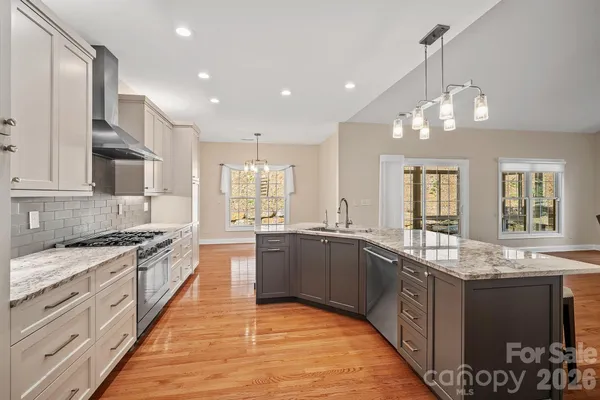 a large kitchen with granite countertop lots of counter top space
