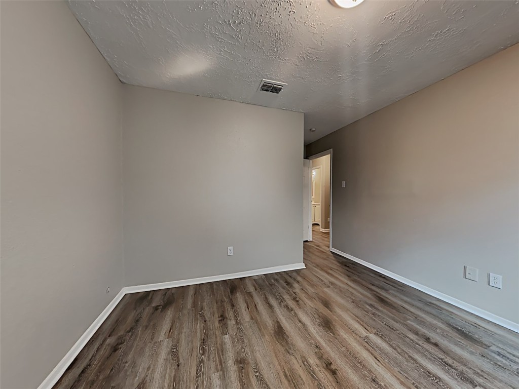 15914 Ridgeroe Lane Houston, TX 77053 - Photo 13 of 18 a view of room with wooden floor