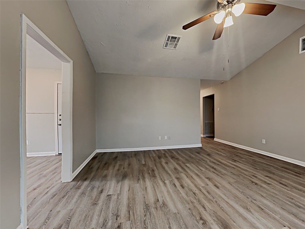 15914 Ridgeroe Lane Houston, TX 77053 - Photo 3 of 18 a view of an empty room with wooden floor