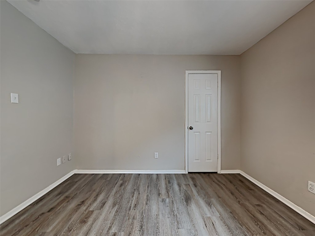15914 Ridgeroe Lane Houston, TX 77053 - Photo 7 of 18 a view of an empty room and wooden floor