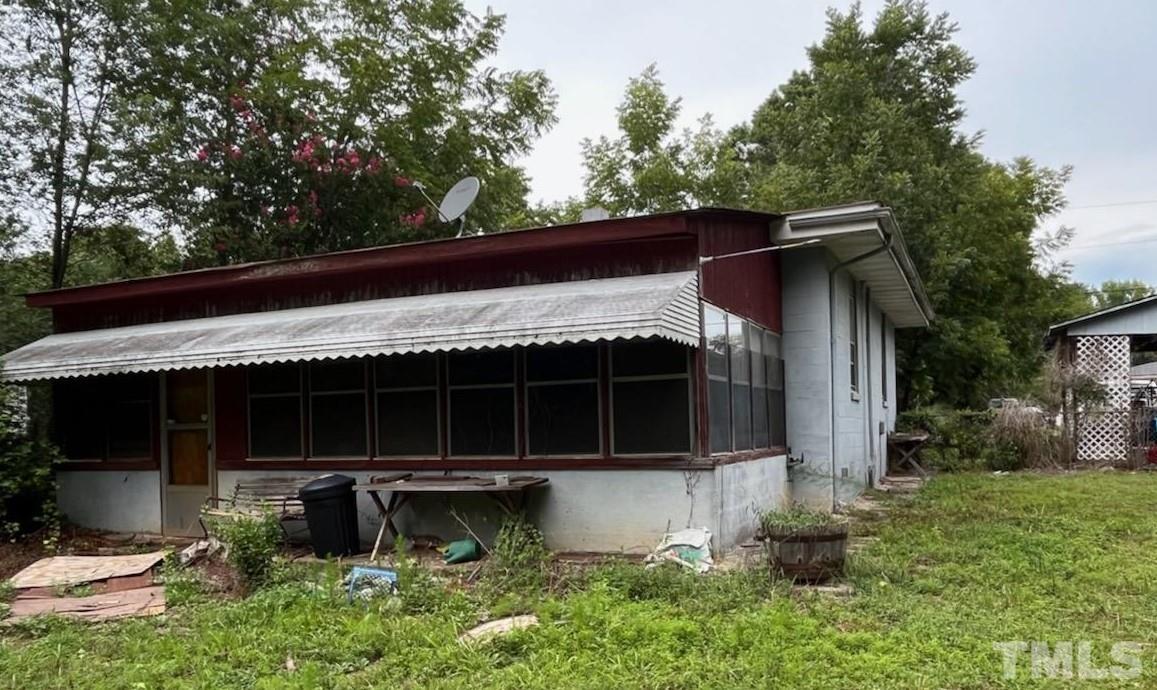 6016 Colonial Drive Raleigh, NC 27603 - Photo 2 of 10 a view of house with outdoor space and sitting area