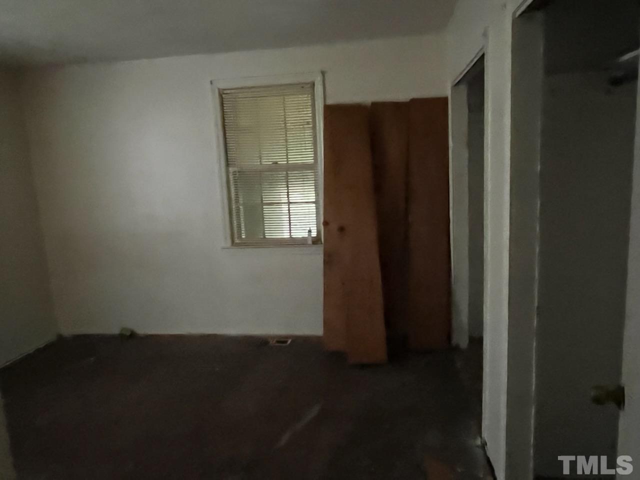 6016 Colonial Drive Raleigh, NC 27603 - Photo 5 of 10 a view of an empty room and window