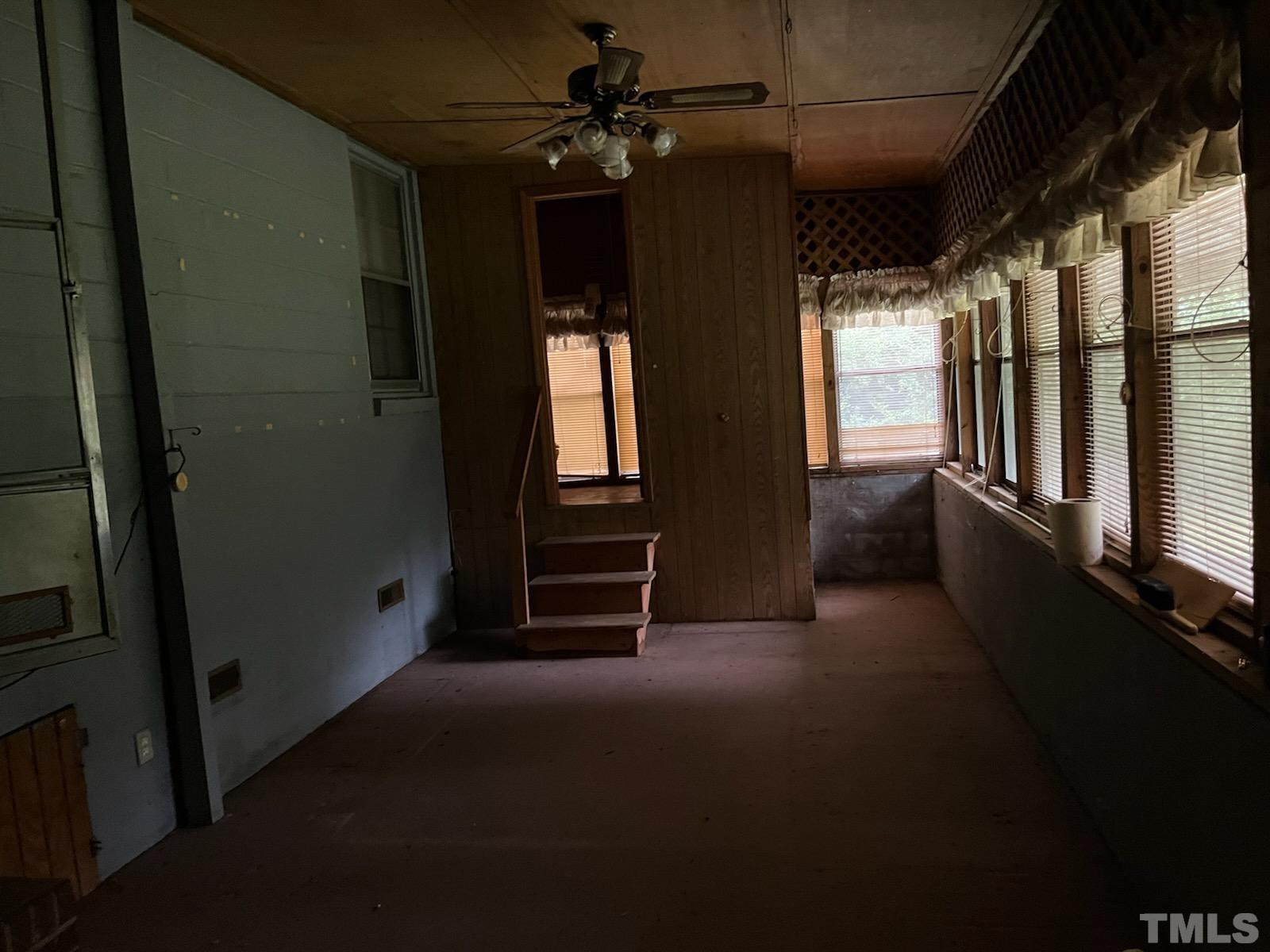 6016 Colonial Drive Raleigh, NC 27603 - Photo 7 of 10 wooden floor in an empty room with a window